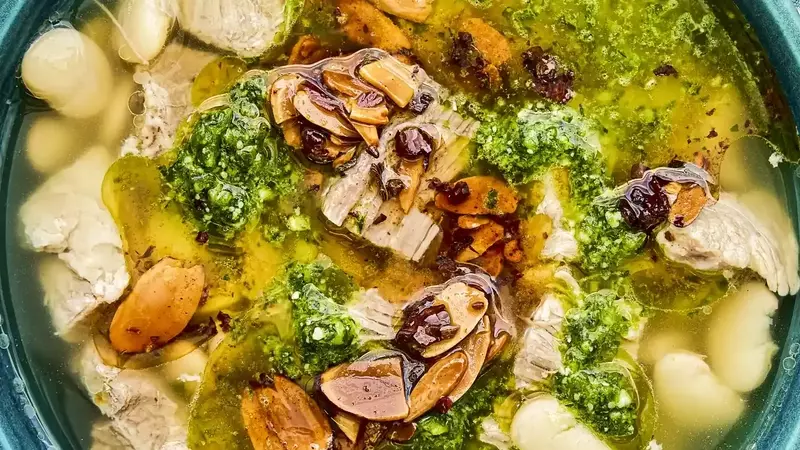 Mexican Brothy Beans with Pork, Salsa Macha, and Cilantro Pesto