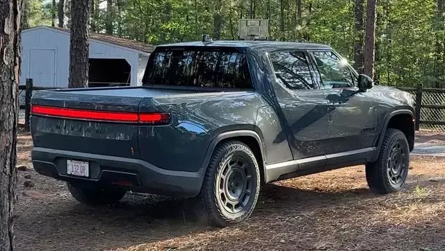 Rivian R1T's Quirky Feature: 'Carolina Squat' Achieved Through Camp Mode