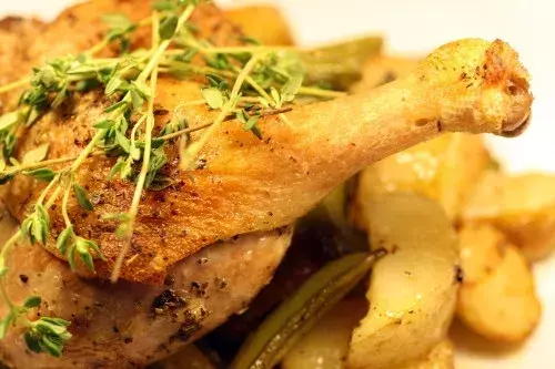 Rustic Roasted Duck Legs with New Potatoes, Sugar Snaps, and Spring Onions