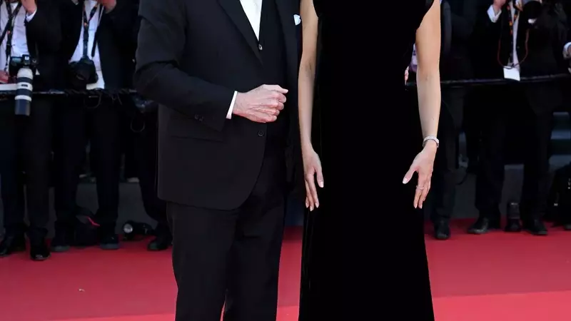 John Travolta's Cannes Style Evolution: From Acting Icon to Beret-Clad Director
